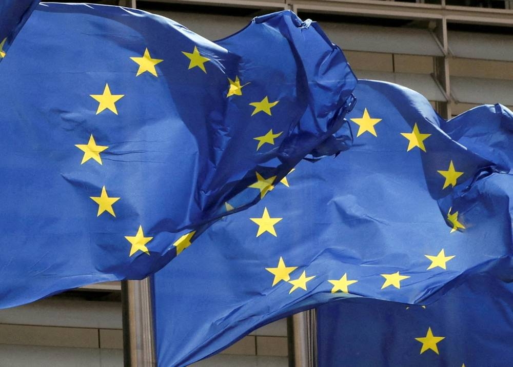 European Union flags flutter outside the EU Commission headquarters in Brussels May 5, 2021. — Reuters pic