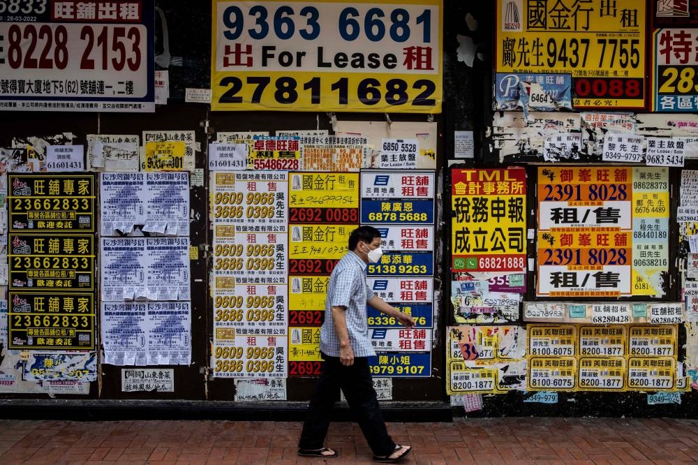 A man walks past a vacant shoplot in Hong Kong, June 7, 2022. The Chinese business hub is preparing for an upcoming leadership change as well as the 25th anniversary of the city’s handover from Britain, for which President Xi Jinping is widely expected to visit. — AFP pic 