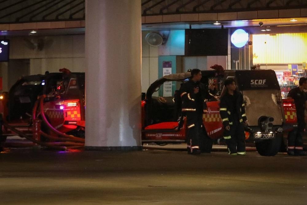 Singapore Civil Defence Force officers and vehicles outside VivoCity mall in Singapore June 7, 2022, after a fire broke out in a mechanical and electrical room. — TODAY pic