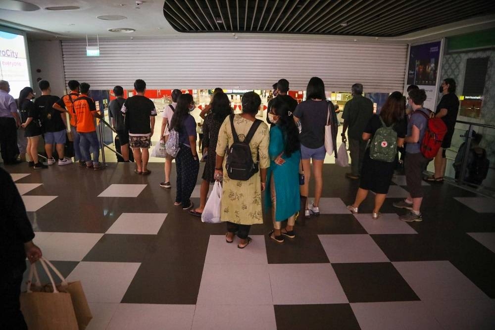 Shoppers outside the second basement level entrance to HarbourFront MRT Station that is linked to VivoCity mall. — TODAY pic