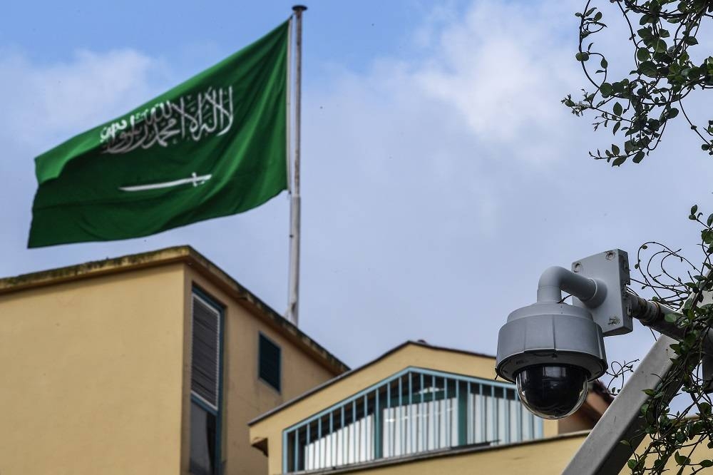 This file picture shows a Saudi Arabia flag and a video camera surveillance at the backyard of the Saudi Arabian consulate on October 11, 2018 in Istanbul. — AFP pic