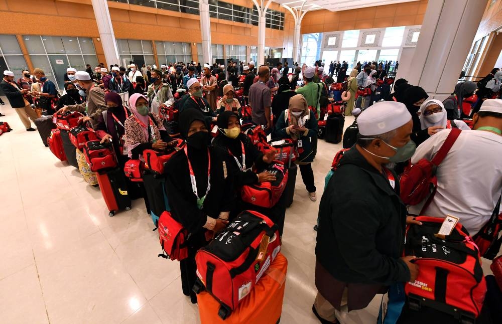 The first group of Haj pilgrims from Malaysia heading to Saudi Arabia are seen at the Movenpick Convention Centre on June 4, 2022. — Bernama pic