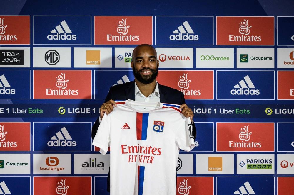 Former France international Alexandre Lacazette poses with his jersey during a press conference to announce his return to Ligue 1 Olympique Lyonnais, June 9, 2022 in Decines-Charpieu, central-eastern France. — AFP pic 