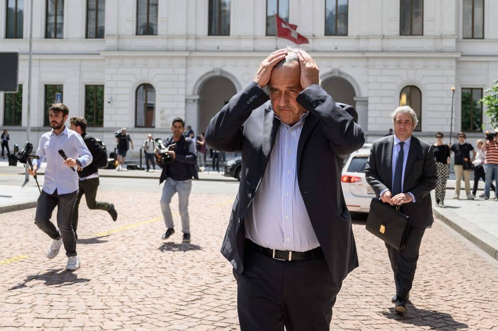 Former Uefa president Michel Platini leaves Switzerland’s Federal Criminal Court after the first day of his trial over a suspected fraudulent payment in the southern Switzerland city of Bellinzona, June 8, 2022. — AFP pic 