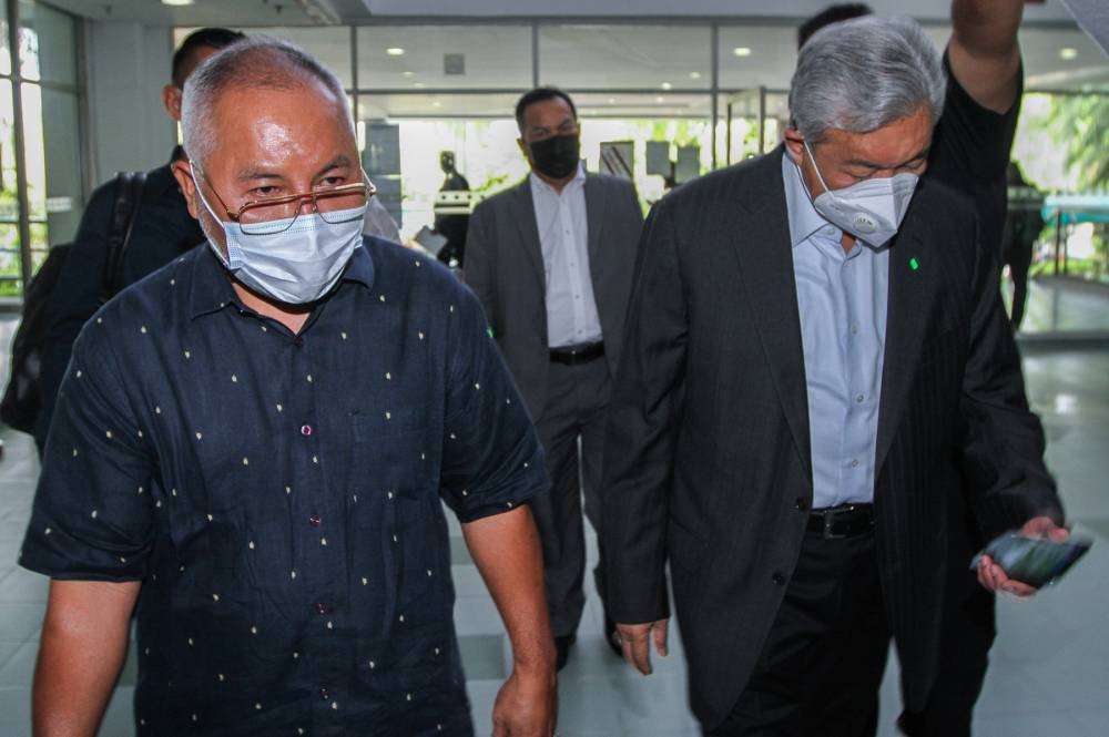 Former deputy prime minister Datuk Seri Ahmad Zahid Hamidi is seen with Mohamad Khir Toyo at the Shah Alam Court May 10, 2022. ― Picture by Miera Zulyana