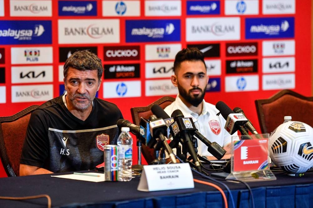 Bahrain chief coach Helio Sousa (left) speaks during a press conference before the 2023 Asian Cup Qualifiers Group E match against Malaysia tomorrow, in Subang Jaya June 10, 2022. — Bernama pic