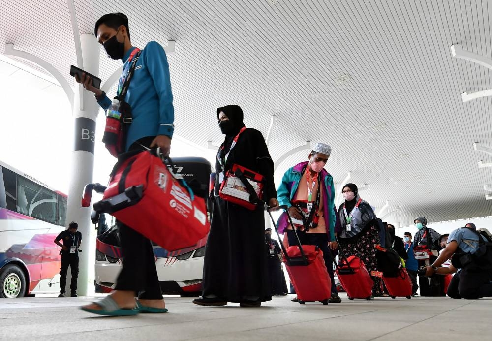 The first group of Malaysian Haj pilgirms are seen waiting for their flight to Saudi Arabia at the Movenpick Convention Centre in Sepang June 4, 2022. — Bernama pic