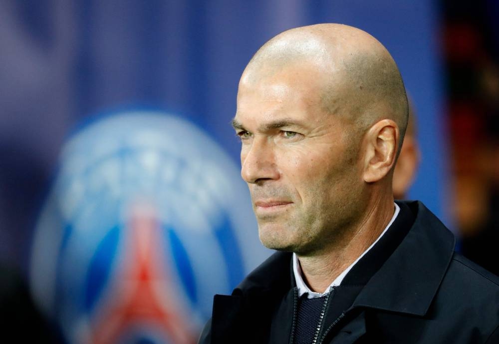 In this file photo taken on September 18, 2019, then Real Madrid's French coach Zinedine Zidane looks on prior to the start of the UEFA Champions league Group A football match between Paris Saint-Germain and Real Madrid at the Parc des Princes stadium in Paris. — AFP pic