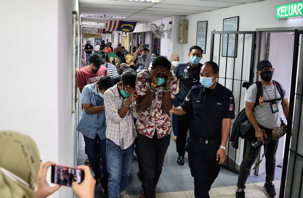 Ten men were each fined RM1,000 by the Ampang Magistrate’s Court for failing to provide an explanation for RM3.14 million belonging to a male private teacher in their bank accounts June 10, 2022. — Bernama pic