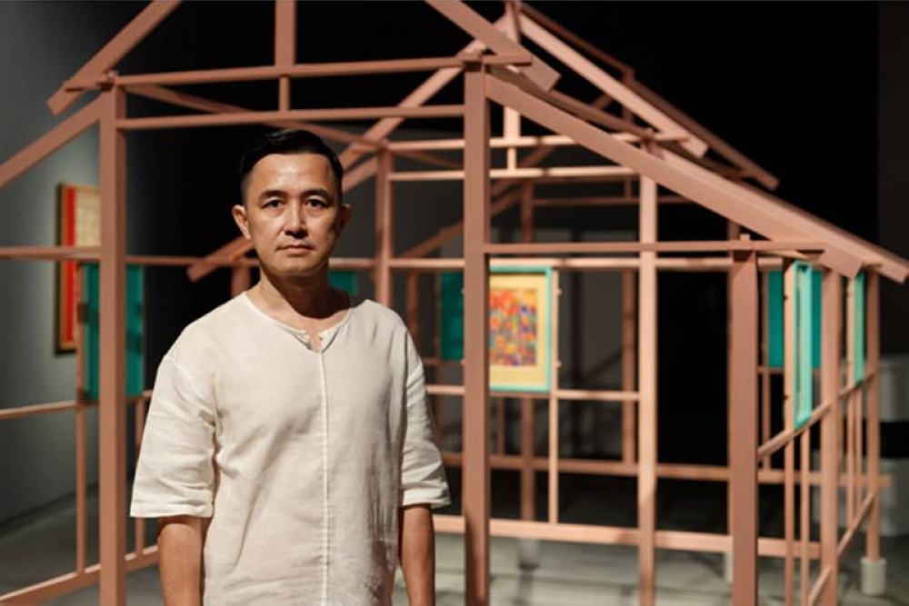 Artist Leon Leong and his new work titled “Stilt Houses – The Floating World of Kampung Baru”. — Pictures courtesy of Leon Leong