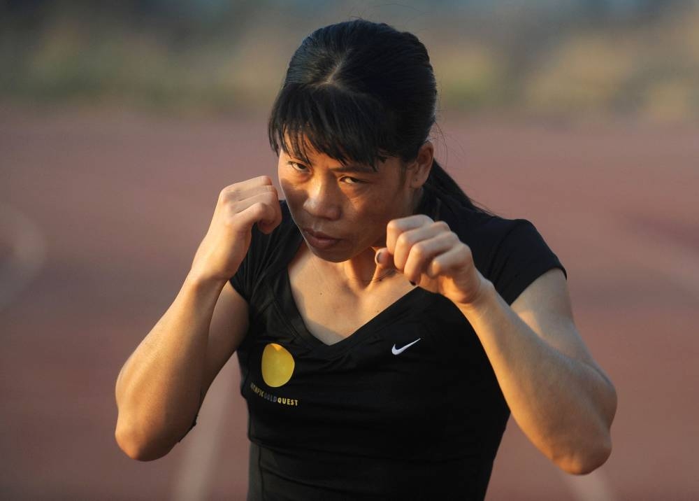 Indian boxer Mary Kom warms up during a training session at the Balewadi Sports Complex in Pune April 20, 2012. — AFP pic