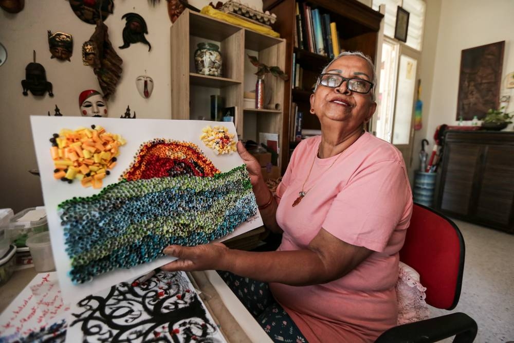 Irene proudly showing off her work. — Picture by Farhan Najib