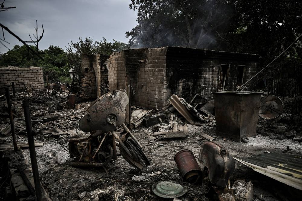 A totally destroyed house is pictured after shelling in the city of Lysychansk in the eastern Ukrainian region of Donbas on June 13, 2022, amid Russian invasion of Ukraine. — AFP pic