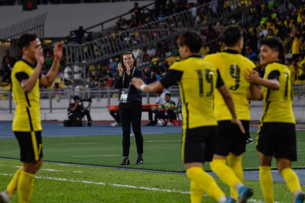 National head coach Kim Pan Gon celebrates Malaysia's victory over Bangladesh at the National Stadium in Bukit Jalil June 14, 2022. — Bernama pic
