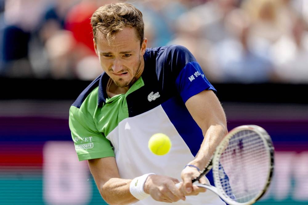 Russia’s Daniil Medvedev plays a backhand return during his match against Netherlands’ Tim Van Rijthoven during the finals of the men’s singles of the Libema Open tennis tournament in Rosmalen, The Netherlands, June 12, 2022. — Sander Koning/ANP handout pic via AFP