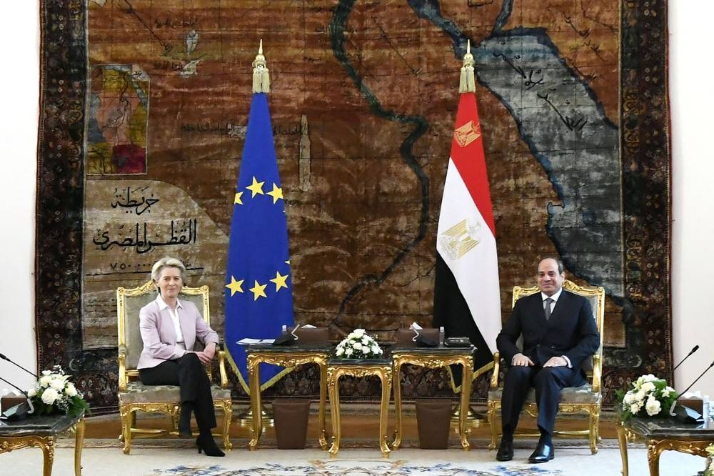 A handout picture released by the Egyptian Presidency shows President Abdel Fattah al-Sisi (right) meeting with the President of the European Commission Ursula von der Leyen (left) at the presidential palace in the capital Cairo on June 15, 2022. — Egyptian Presidency handout pic via AFP