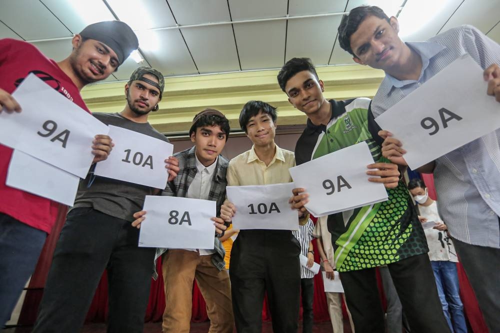 SMK St Michael students pose for the camera after receiving their SPM 2021 results in Ipoh June 16, 2022. — Picture by Farhan Najib