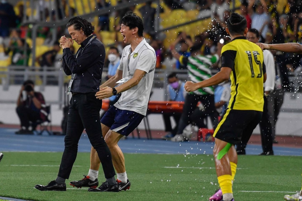 Harimau Malaya head coach Kim Pan Gon celebrates the victory of his men after beating Bangladesh in the Group E Match, 2023 Asian Cup Qualifiers Final at the Bukit Jalil National Stadium, June 14, 2022. — Bernama pic 