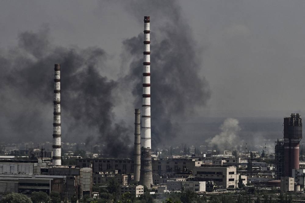 Smoke and dirt rise from the city of Severodonetsk during fighting between Ukrainian and Russian troops at the eastern Ukrainian region of Donbas on June 14, 2022, amid Russian invasion of Ukraine. — AFP pic