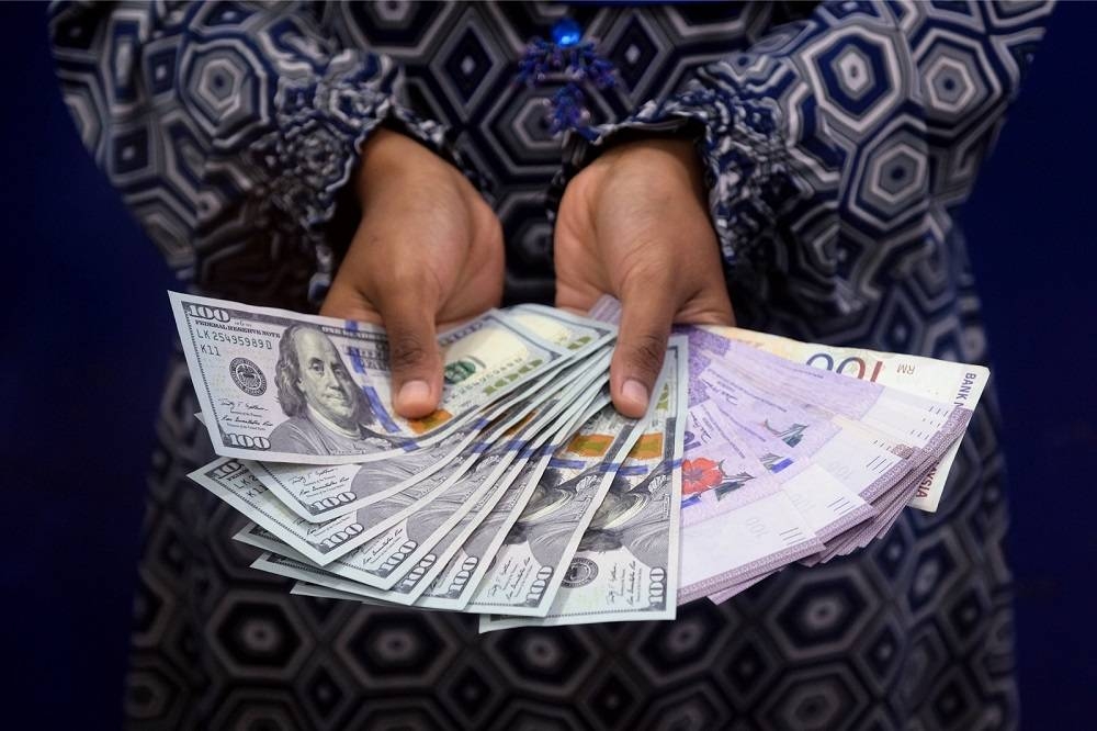 Ringgit opens higher against US dollar
