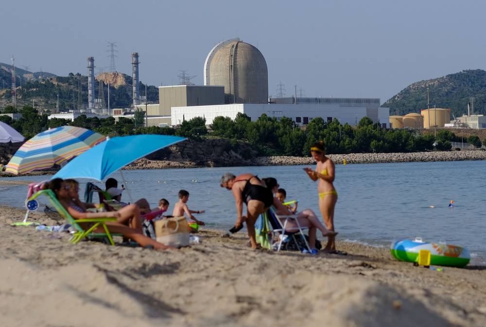 The Vandellos II Nuclear Power Plant is pictured as people enjoy the weather at Almadraba beach in Hospitalet del Infante, as a heatwave hits Spain, June 17, 2022. ― Reuters pic