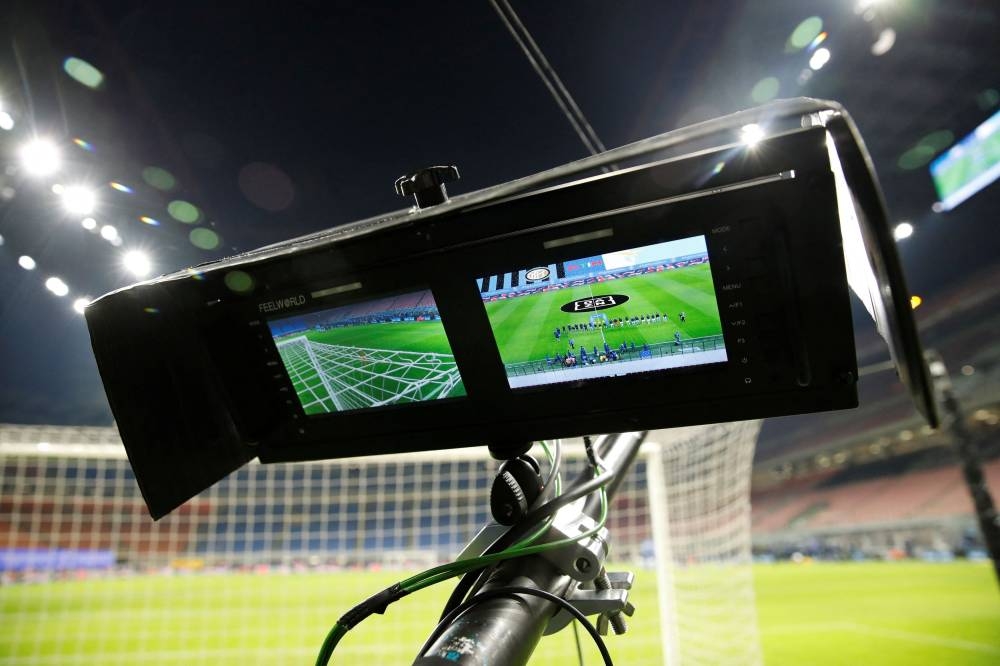 A general view of a camera screen showing the players line up before the Serie A match between Inter Milan and Lazio at San Siro, Milan in this file picture taken on February 14, 2021. — Reuters pic