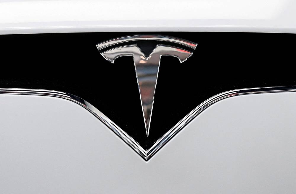 The Tesla logo is seen on a car at Tesla Motors' new showroom in Manhattan's Meatpacking District in New York City December 14, 2017. — Reuters pic