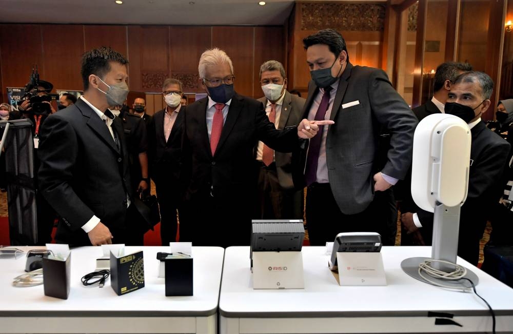 Home Minister Datuk Seri Hamzah Zainudin at the NIISe project contract handover ceremony in Kuala Lumpur, June 21, 2022. He said the ministry has yet to hold discussions with UNHCR on the matter. — Bernama pic 