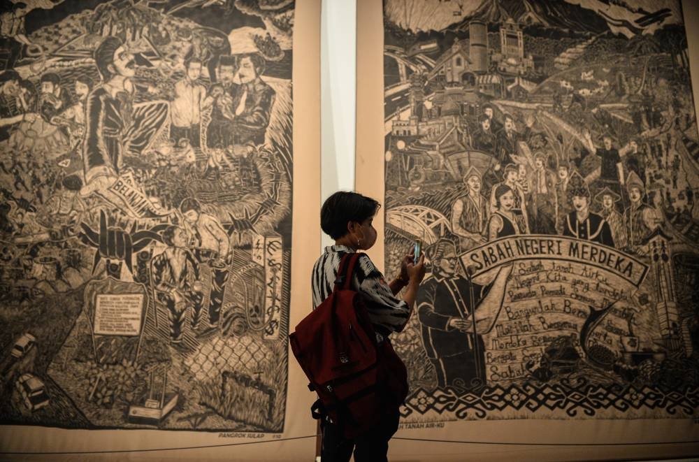 Visitors and art activists came to see some of the visual art exhibition at the reopening of the National Art Gallery in Kuala Lumpur, June 21, 2022. — Bernama pic 
