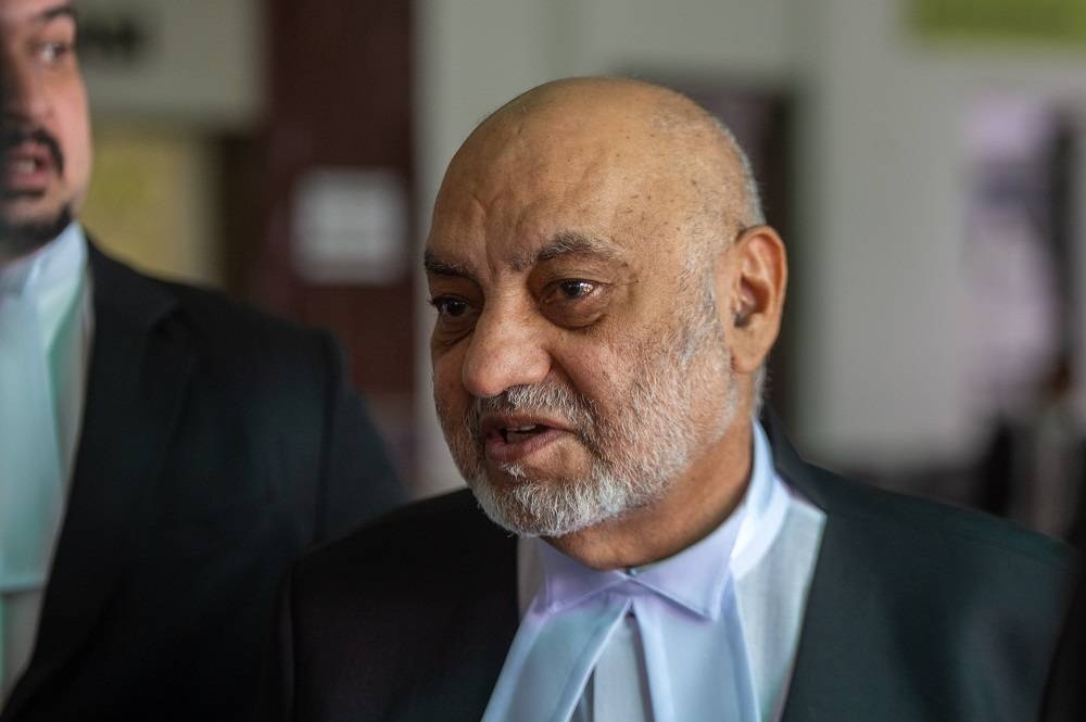 Lawyer Datuk Gurdial Singh Nijar speaks to reporters at the Shah Alam Court complex  April 11, 2022. — Picture by Shafwan Zaidon