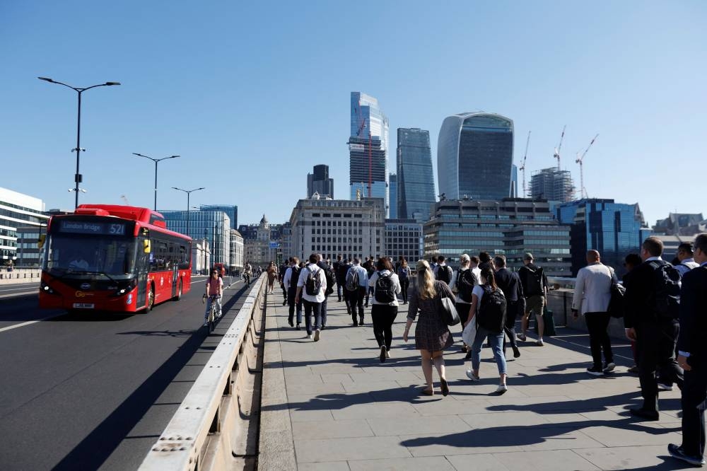 People on London Bridge, the day after a national rail strike, during six days of travel disruption, in London, Britain, June 22, 2022. — Reuters pic