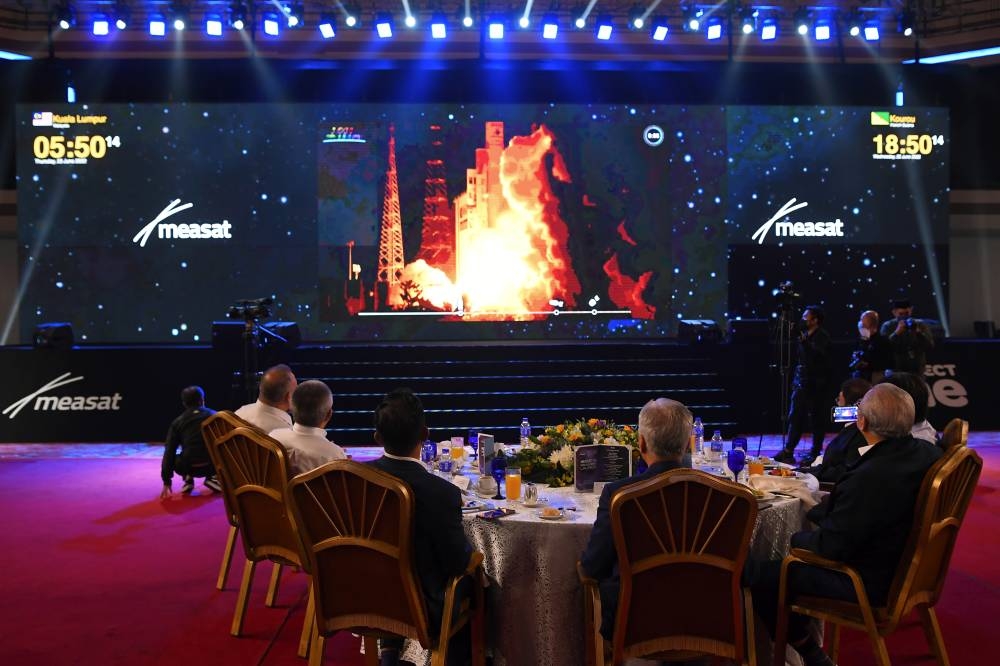 Prime Minister Datuk Seri Ismail Sabri Yaakob watches a live stream of Measat-3d's launch from the Kourou Space Centre in French Guiana at World Trade Centre Kuala Lumpur June 23, 2022. — Bernama pic