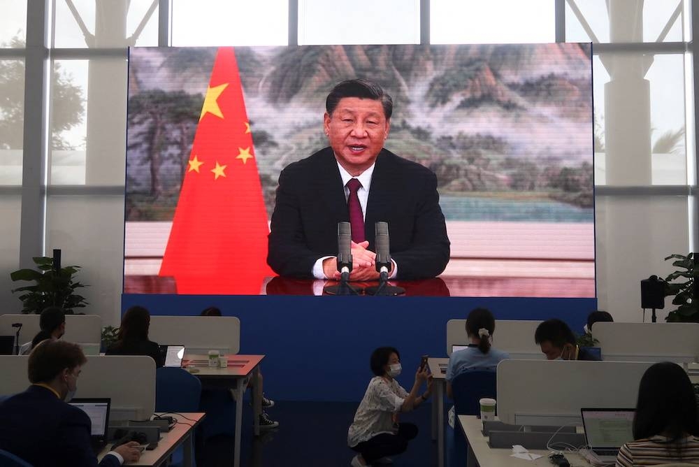 A screen shows Chinese President Xi Jinping delivering a keynote speech at the opening ceremony of the Boao Forum for Asia via video link, at a media centre in Boao, Hainan province, China April 21, 2022. — Reuters pic