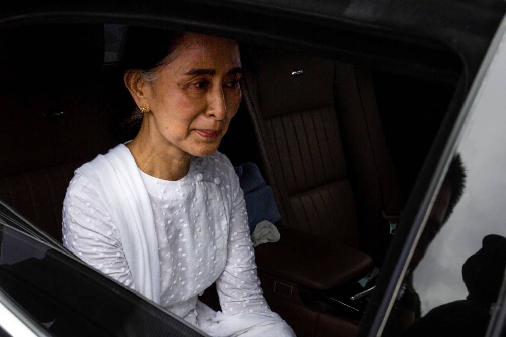 In this file photo taken on August 17, 2017, Myanmar's State Counselor Aung San Suu Kyi leaves after attending the funeral service for the National League for Democracy (NLD) party's former chairman Aung Shwe in Yangon. — AFP pic