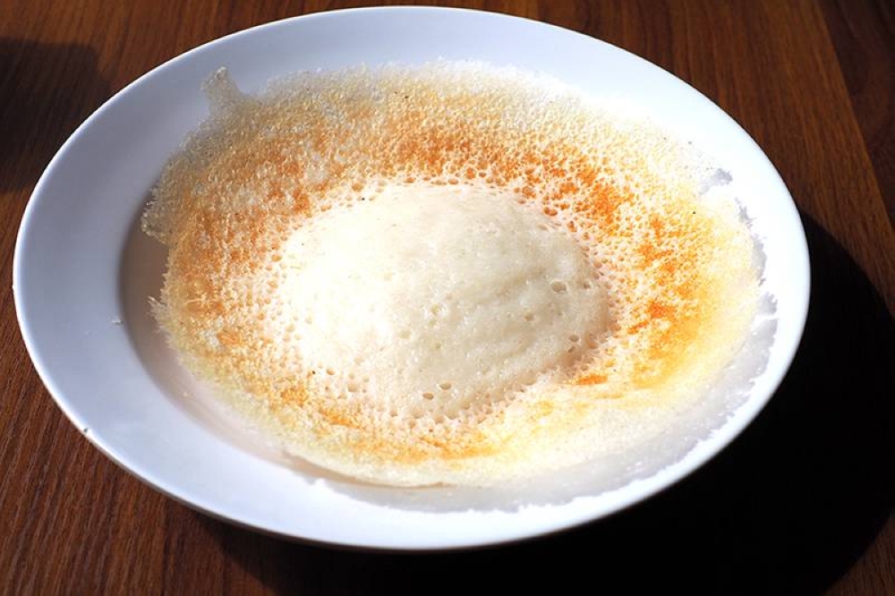 Plain 'appam' is also excellent with a slight bouncy texture from the fermented rice batter.