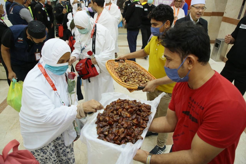 File picture shows some of the 291 pilgrims arriving at the Land Premium hotel, in Makkah, June 12, 2022. — Bernama pic