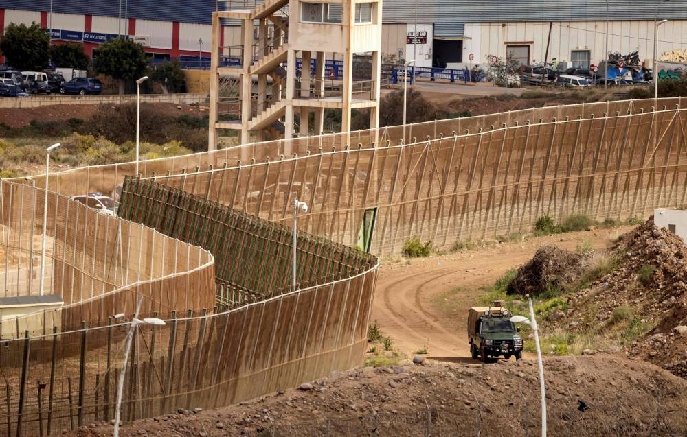 This file photo taken on March 4, 2022 shows a view of the border fence separating Morocco (right) from Spain's North African Melilla enclave (left), near Nador in Morocco. — AFP pic