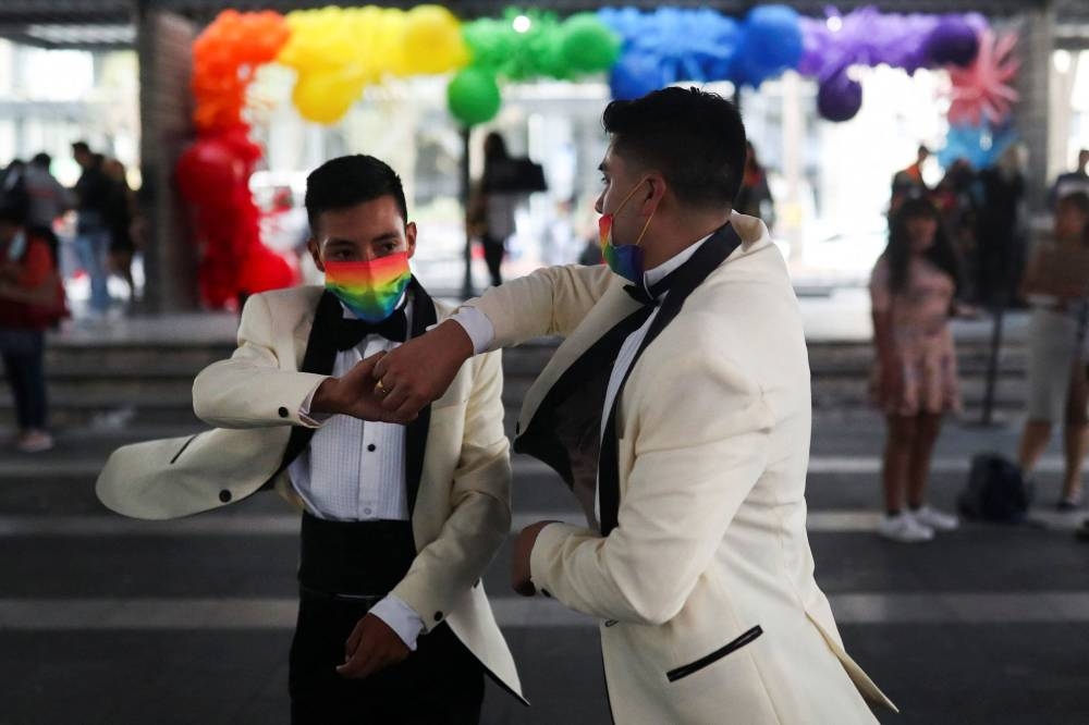 A couple dances as they celebrate LGBTQ  pride month with a massive wedding of same sex couples in Mexico City, Mexico June 24, 2022. ― Reuters pic