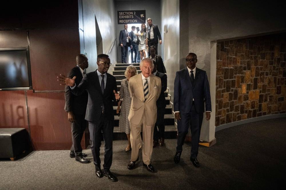 Britain’s Prince Charles (centre), Prince of Wales, is seen during a visit of the Kigali Genocide Memorial, Kigali, Rwanda on June 22, 2022 during a visit. — AFP pic