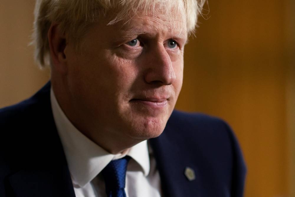 File photo of British Prime Minister Boris Johnson leaving after speaking at a news conference during the Commonwealth Heads of Government Meeting at Lemigo Hotel, in Kigali, Rwanda June 24, 2022. — Reuters pic