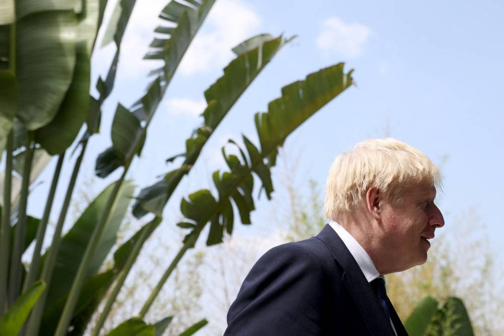 British Prime Minister Boris Johnson arrives for day six of the Commonwealth Heads of Government Meeting at the Intare Conference centre in Kigali, Rwanda June 25, 2022. — Reuters pic 