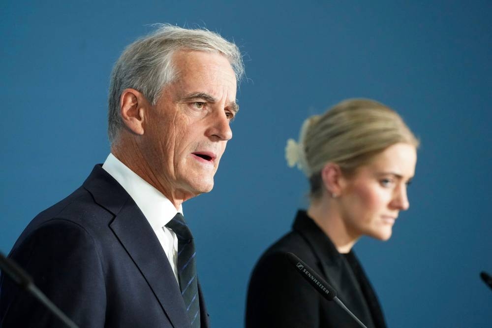 Minister of Justice and Public Security Emilie Enger Mehl (right) and Norwegian Prime Minister Jonas Gahr Store attend a press conference on the deadly overnight shooting near a gay bar in Oslo on June 25, 2022. — AFP pic