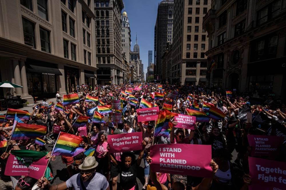 Participants march during the 2022 New York Pride Parade in New York City on June 26, 2022. — AFP pic