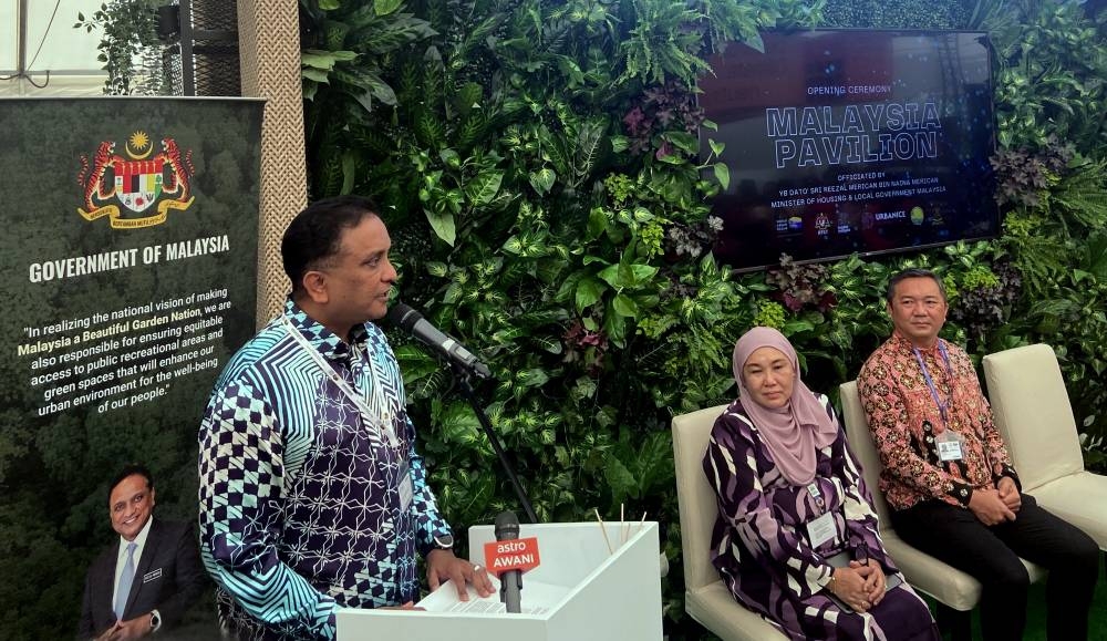 Housing and Local Government Minister Datuk Seri Reezal Merican Naina Merican delivers a speech at the launch of the Malaysia Pavilion and the soft launch of iDAM at the WUF11 in Poland, June 27, 2022. — Bernama pic 