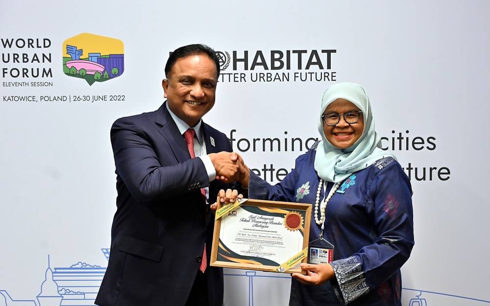 Reezal Merican (left) said the Malaysian government has been placing much emphasis on the overall wellbeing and liveability of its 32 million population. — Bernama pic