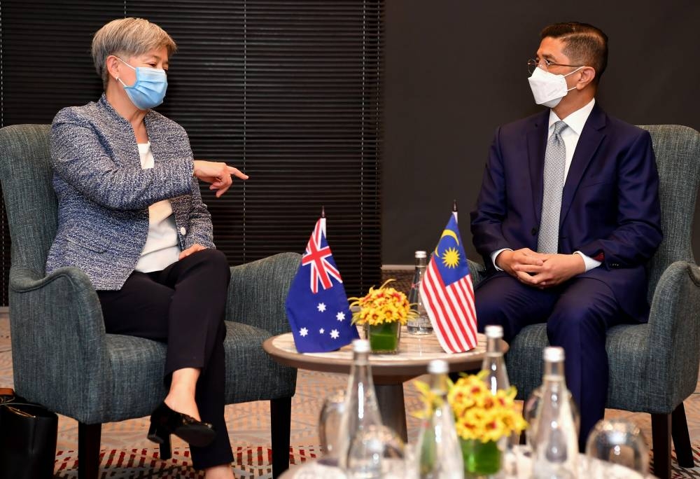 Senior Minister of International Trade and Industry Datuk Seri Mohamed Azmin Ali received a courtesy call from Australia’s Foreign Minister Senator Penny Wong at Putrajaya, June 29, 2022. — Bernama pic 