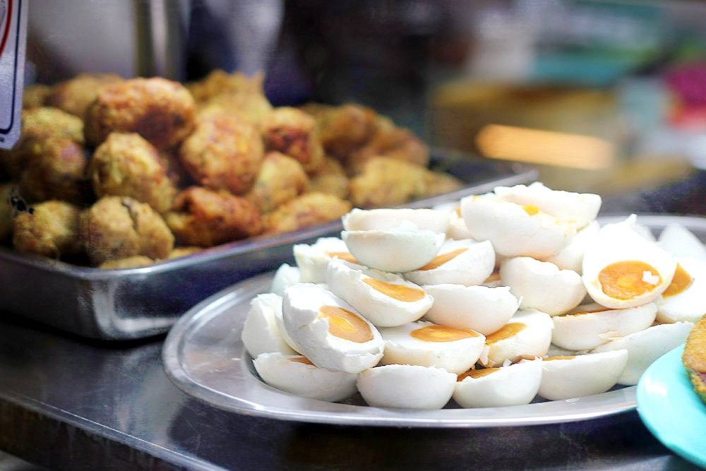 'Bergedil' (left) and 'telur masin' or salted eggs (right).