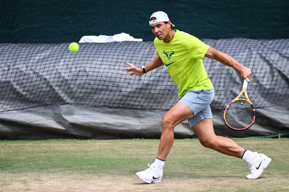 Spain’s Rafael Nadal returns the ball during a training session during the 2022 Wimbledon Championships at The All England Tennis Club in Wimbledon, south-west London, June 26, 2022. — AFP pic 