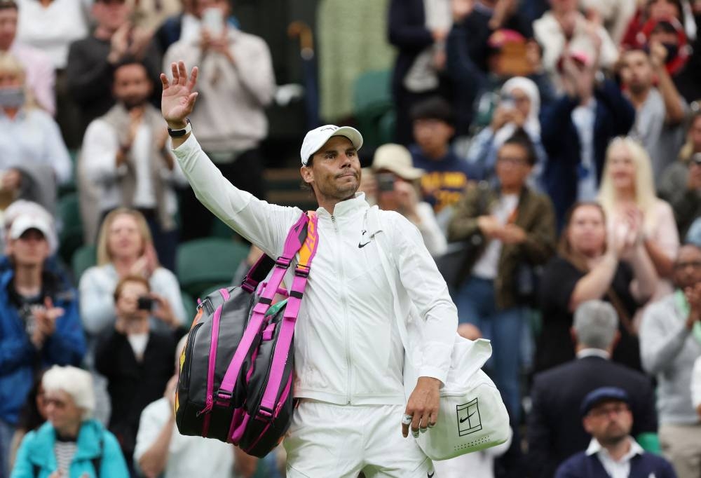 Rafael Nadal leaves court after winning his second round match against Ricardas Berankis at the All England Lawn Tennis and Croquet Club, London June 30, 2022. — Reuters pic