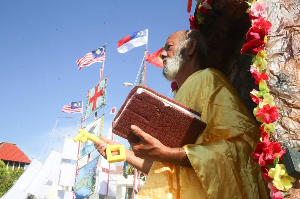 John Dias portraying St Peter in the boat decoration contest during the Festa San Pedro in Melaka, June 29, 2022. — Picture by Choo Choy May